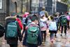 School group walking along street
