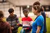 Children are led in an activity by a PGL instructor
