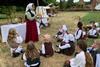 Pupils taking part in a Tudor Day event at Kentwell Hall in Suffolk
