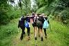 A group of girls head off into the woods during a trip with the YHA