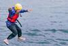 Pupil jumping into the sea at Conway Centres