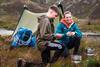 Two teenagers enjoying a camping trip with The Outward Bound Trust