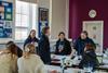 Princess Anne talks with a group of students and staff in a laboratory