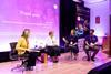 People speak on stage at the National Educational Visits Conference