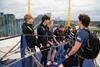 Students listen to an instructor during a climb as part of Up at The O2 experience