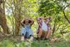 Children with pretend binoculars in the woods