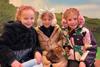 Children from Ferncumbe Church of England School handling guinea pigs at Hatton Adventure World