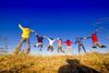 Kids jumping on hill