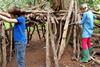 Children building a den