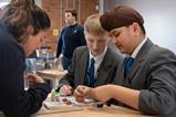 Students put a piece of equipment together at the Derwent Valley Museum of Making