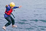 Pupil jumping into the sea at Conway Centres