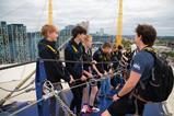 Students listen to an instructor during a climb as part of Up at The O2 experience