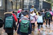 School group walking along street