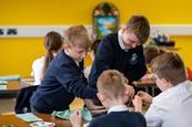 School children working together on an art project at the Black Country Living Museum in Dudley.