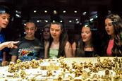 Students look at a model during a school trip to Normandy, France.