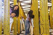 Two kids in a mirror maze