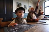 Children dressed as Victorians in a school lesson