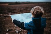 Child looking at a map