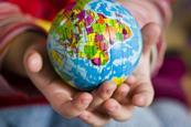 Child holding a globe