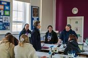 Princess Anne talks with a group of students and staff in a laboratory