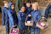 Children collect eggs during a stay at one of the Farms for City Children farms