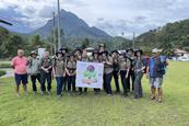 Walsall Academy students and staff show their banner during a Borneo expedition