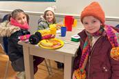 Ferncumbe Church of England School students eating breakfast at Hatton Adventure World