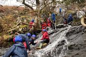 Hammersmith Academy students tackle a rocky river as part of their Outward Bound residential in the Lake District