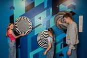 Kids interact with illusion displays