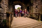 School pupils walking through the gate of Portchester Castle in Hampshire