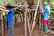 Children building a den