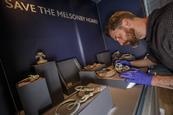 Dr Adam Parker installing the Melsonby Hoard in the Yorkshire Museum