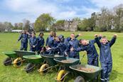 A group of children with their wheelbarrows at Farms for City Children