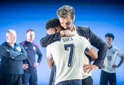 Tane Siah (Bukayo Saka) and Gwilym Lee (Gareth Southgate) in Dear England at the National Theatre