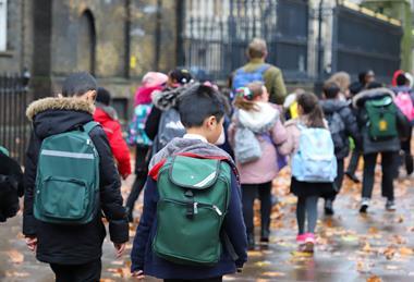 School group walking along street