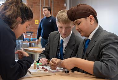 Students put a piece of equipment together at the Derwent Valley Museum of Making
