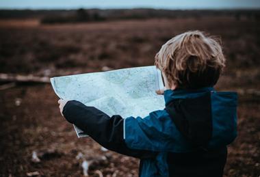 Child looking at a map