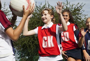 Pupils playing netball