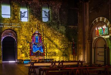 A projection on the wall at Norwich Castle Keep telling the story of the building of Norwich Castle