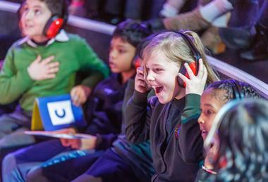 Children wearing ear defenders at Techniquest
