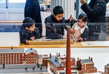 Children explore an exhibition at The Harris, Preston