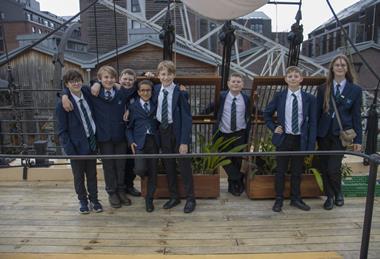 A group of children planting orchids aboard SS Great Britain in Bristol