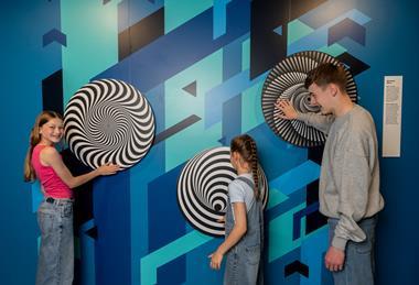 Kids interact with illusion displays