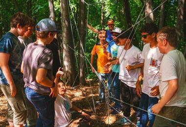 Students problem solving on their screen free outdoor adventure with Mendip Activity Centre