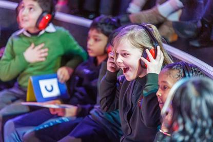 Children wearing ear defenders at Techniquest