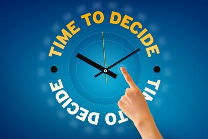 Hand pointing at a Time to Decide clock illustration