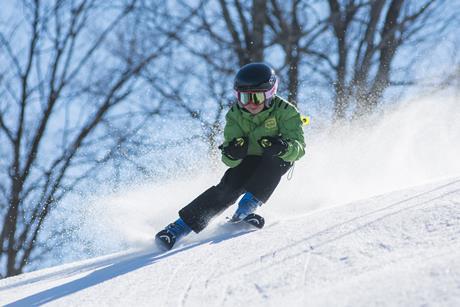 Pupil skiing on a school trip