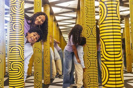 Two kids in a mirror maze