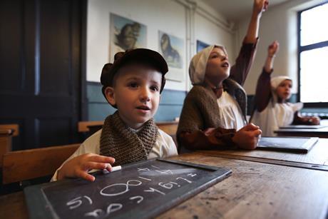 Children dressed as Victorians in a school lesson
