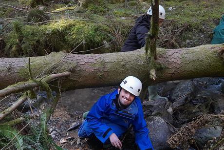 A student climbing on rocks
